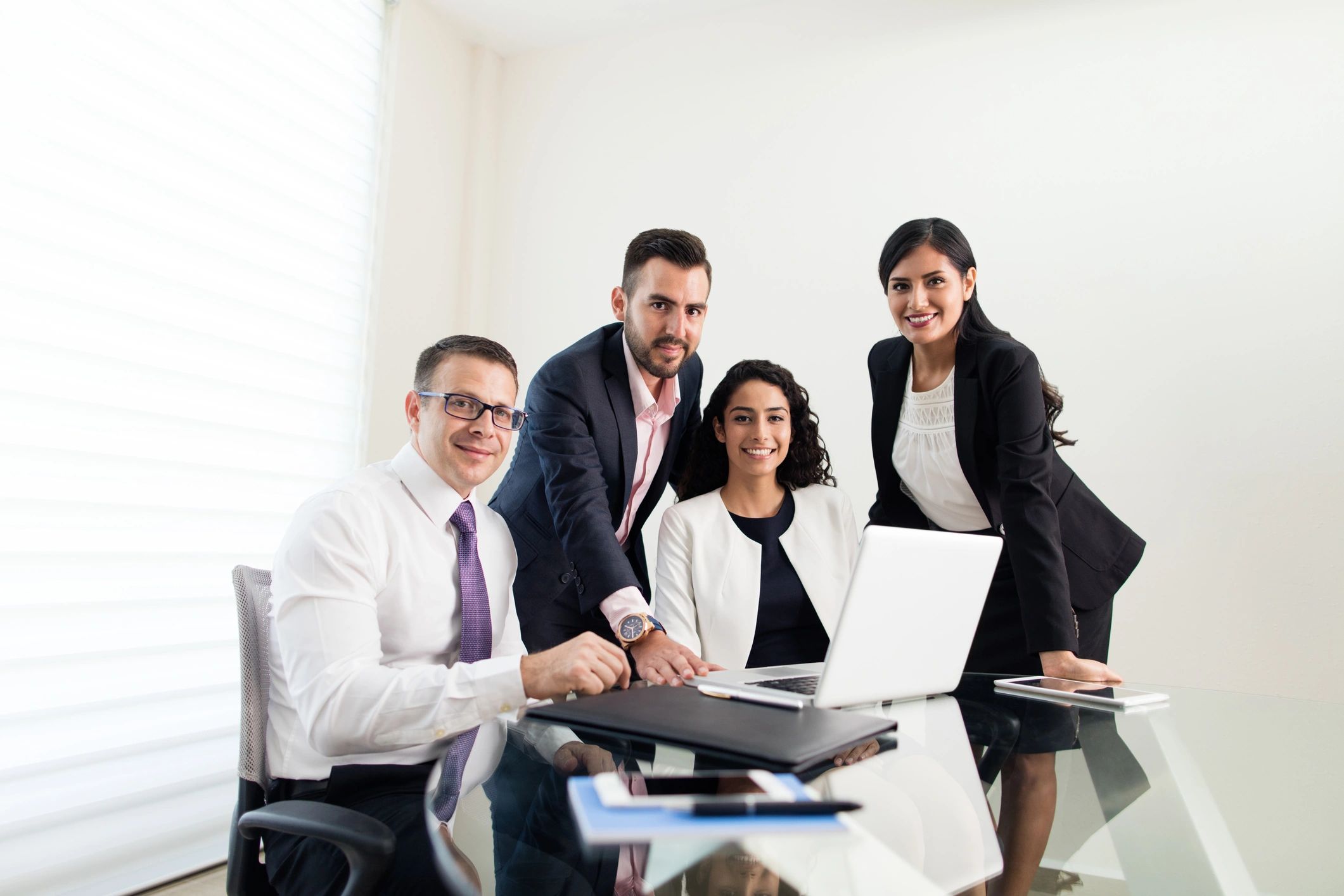 Business consulting team smiling in an office setting