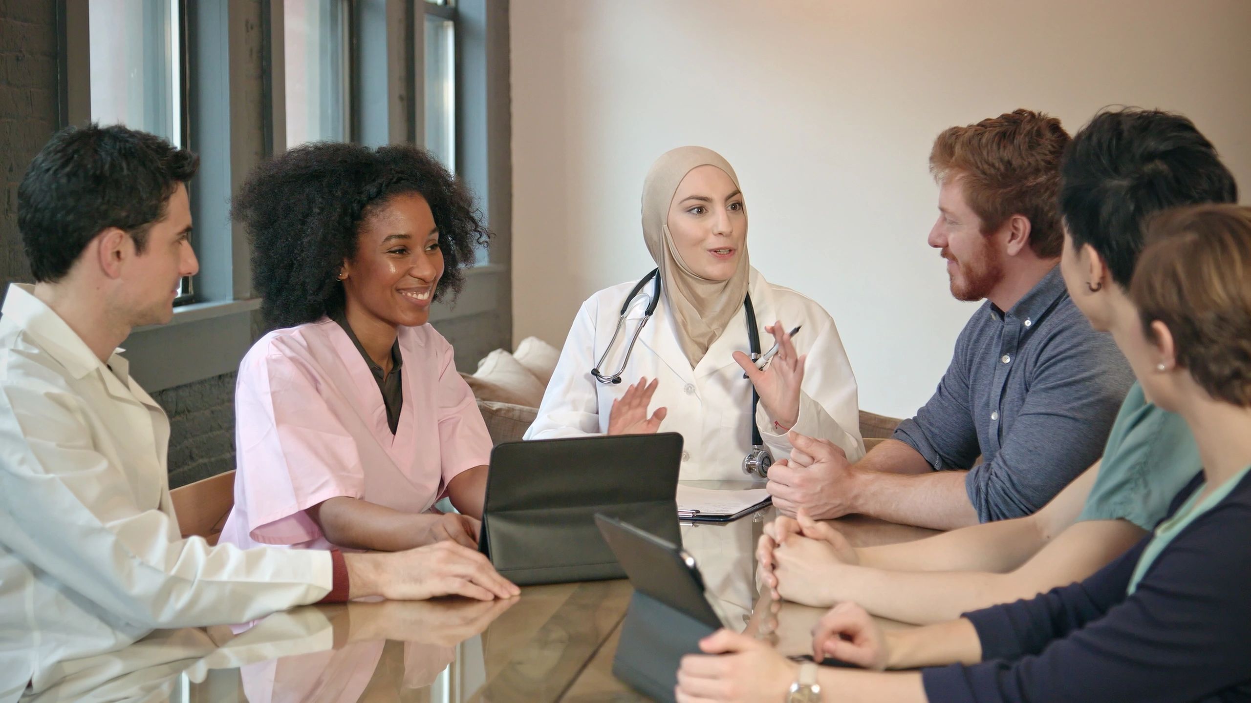 Healthcare professionals meeting to discuss home care strategy